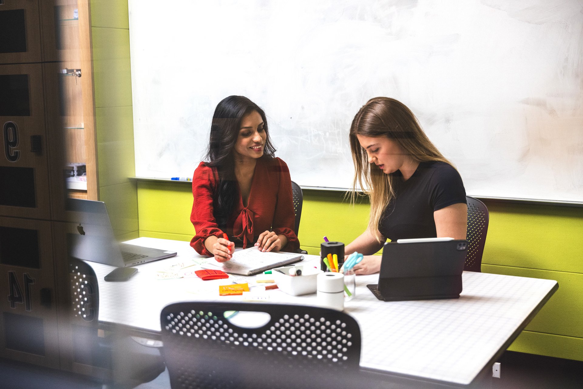 Two women in a meeting room