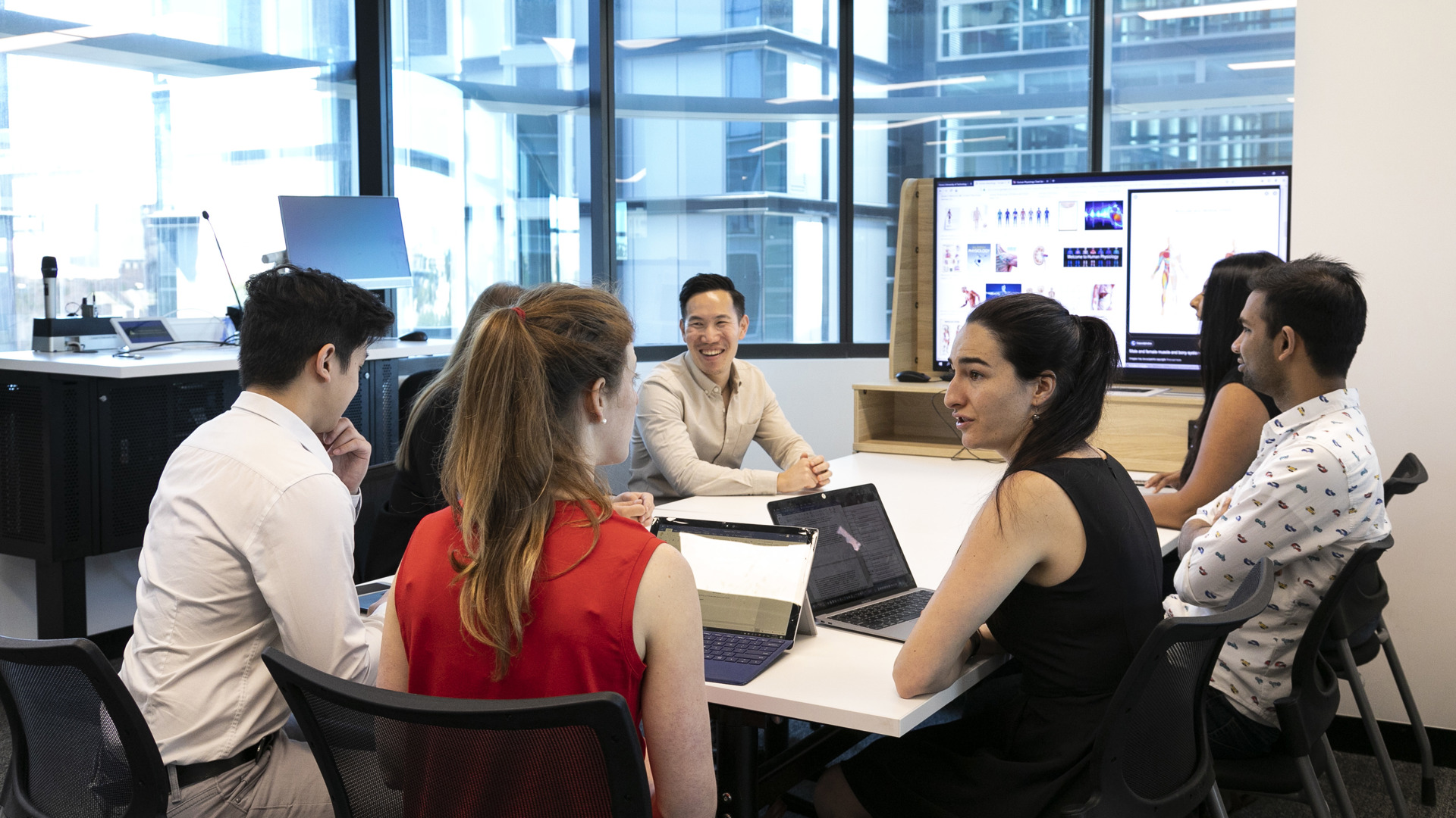 A group of professionals in a meeting room.